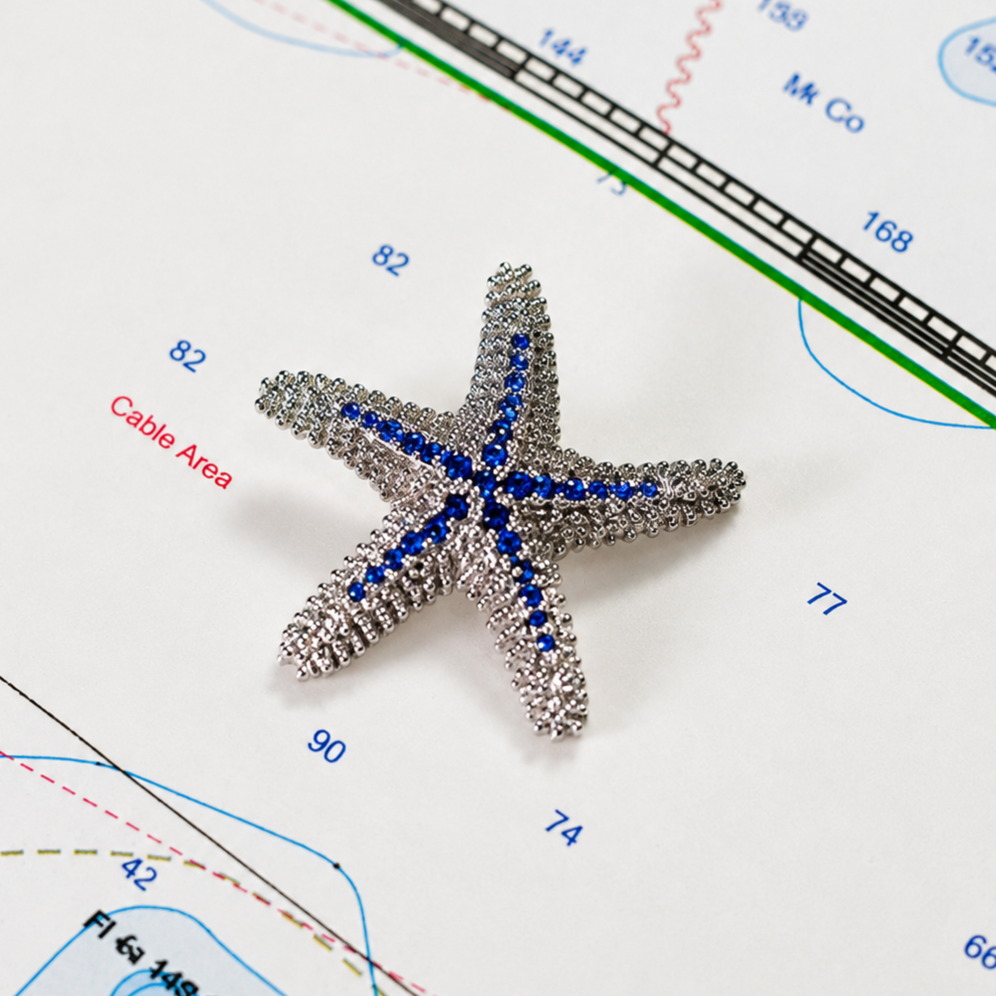 Starfish Pendant in .925 Sterling Silver with 33 Blue Sapphires