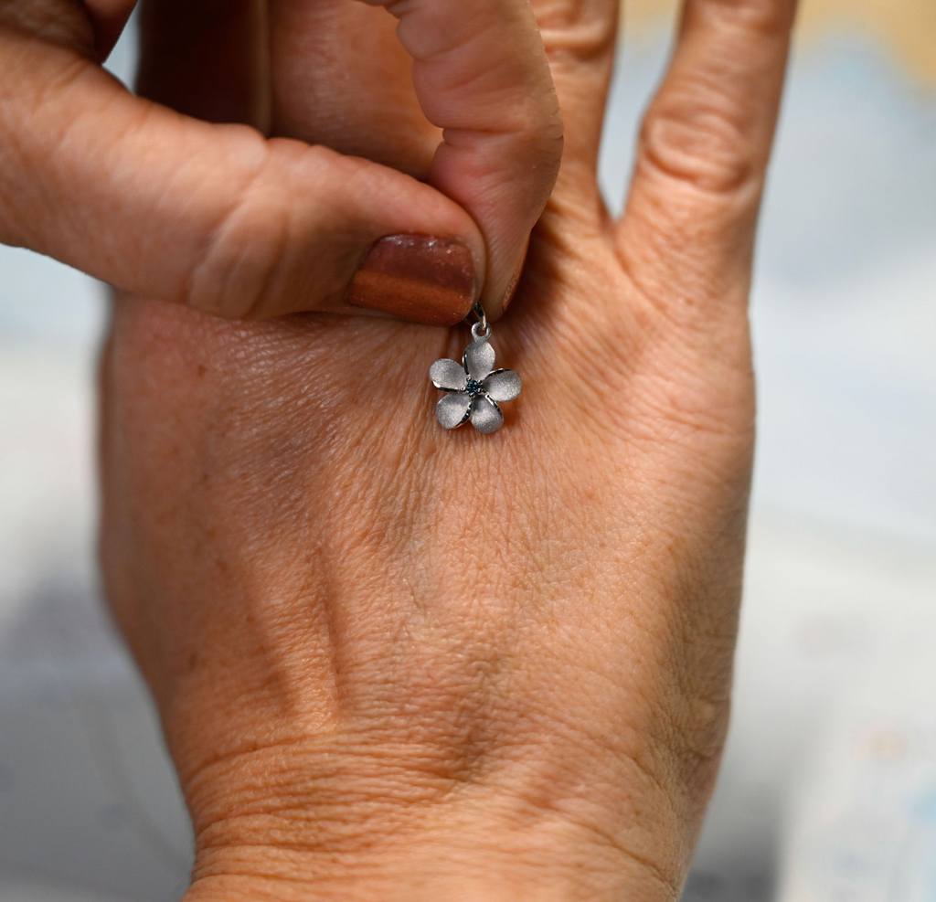 14kwg 11mm Plumeria Pendant w/blue diamonds (.02cttw)