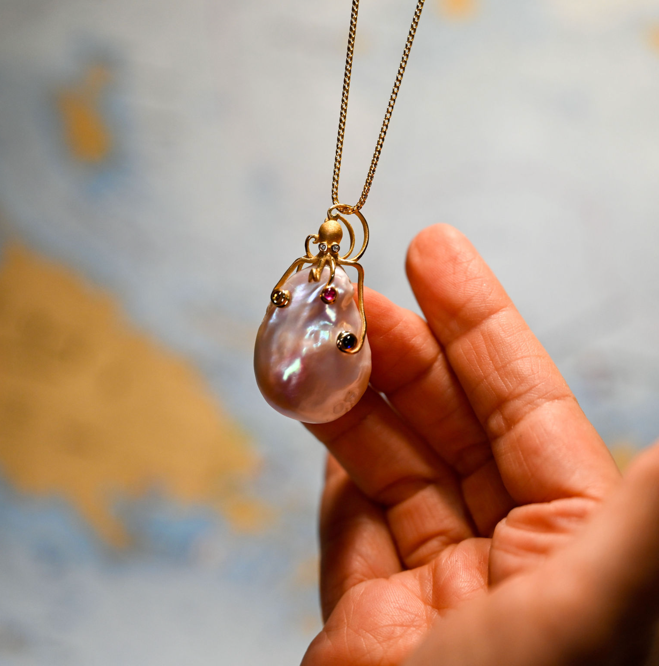 14kyg Octopus Pendant with 2 diamonds (.01cttw) color sapphires