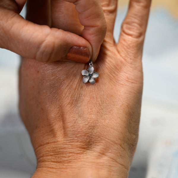 14kwg 11mm Plumeria Pendant w/blue diamonds (.02cttw)